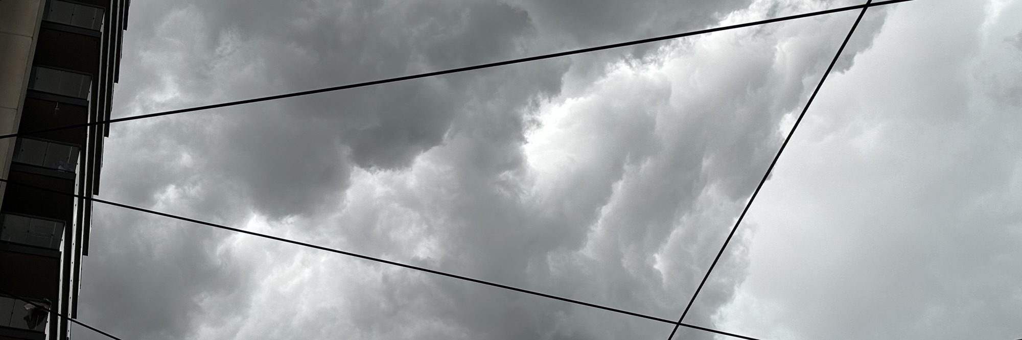 Power lines against a summer stormy sky.